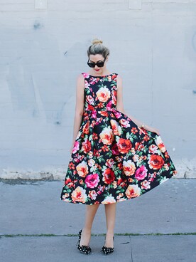 Caitlin Lindquist is wearing "Exotic Amorous Floral Prom Dress"