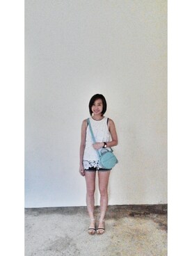 A Crowd SG employee Chee Ling is wearing Love Bonito "Arlette Crossover Bag in Mint"