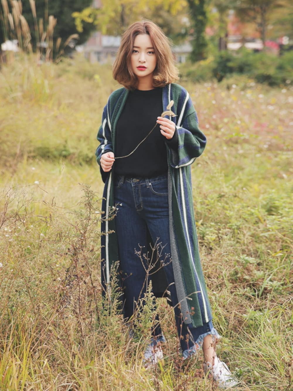 グリーン系のその他を着用したレディースの秋コーディネートの1枚目の写真