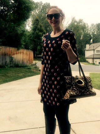 the reluctant adult  is wearing Dolce & Gabbana "Dolce&Gabbana Medium Leopard Print Shopper Tote"