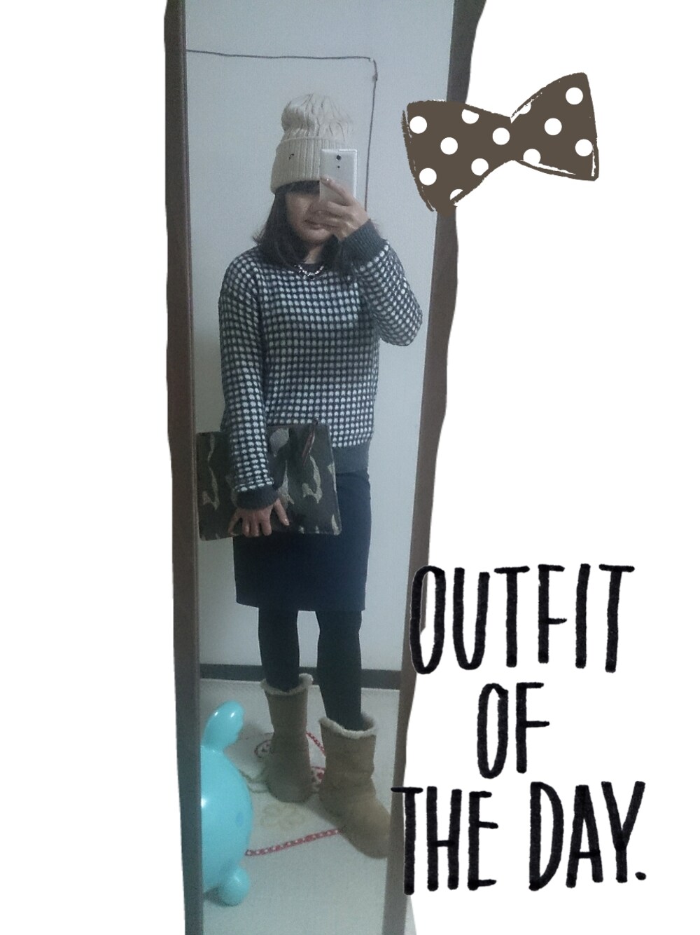 グレー系のニット/セーター、ブルー系のスカート、その他のクラッチバッグを着用したレディースの冬コーディネートの1枚目の写真