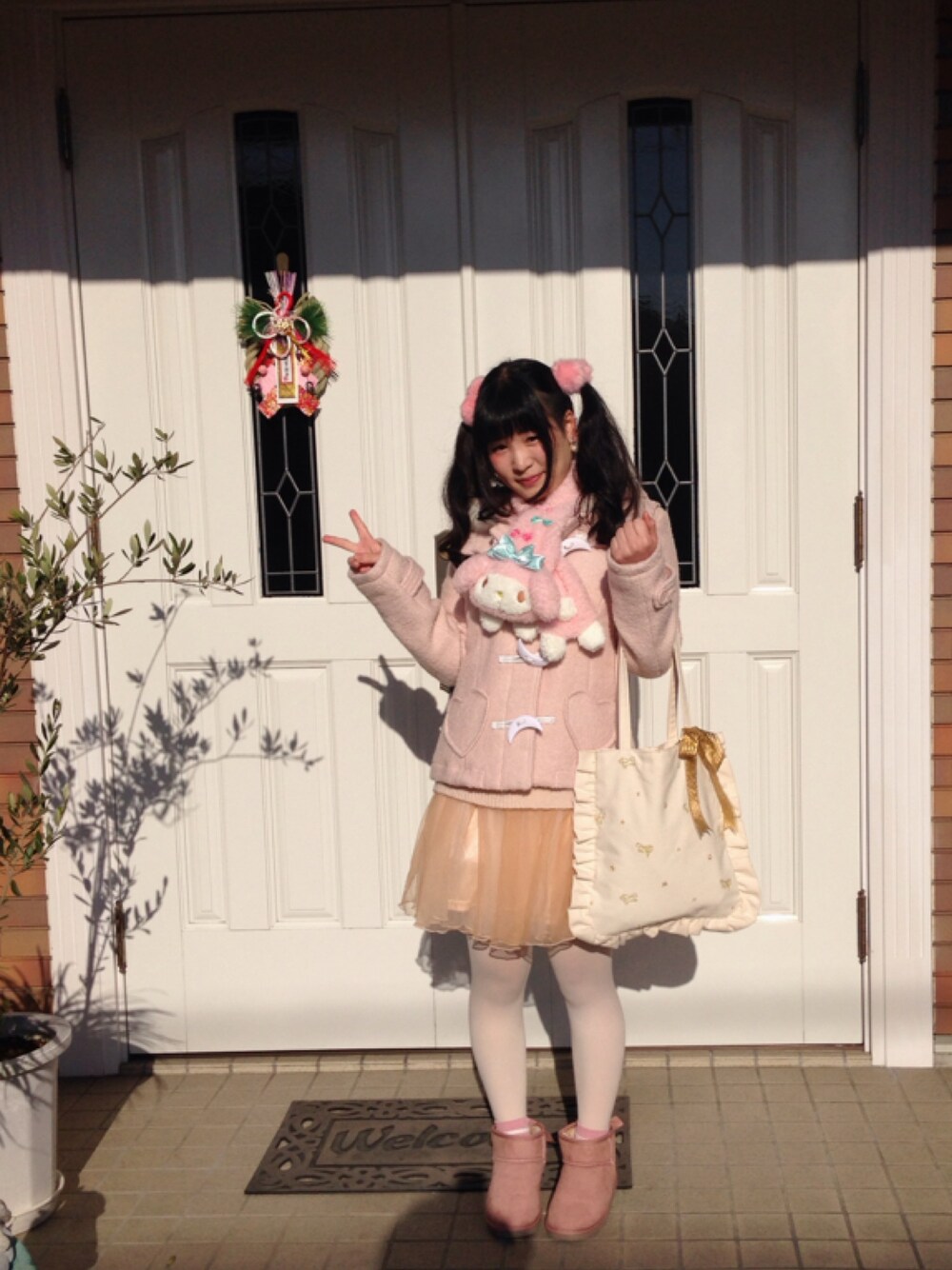 「Sanrioのアイテム（マフラー、ピンク系）」を使った、まなてぃえんぬさん（レディース・153cm）の冬コーディネートの1枚目の写真