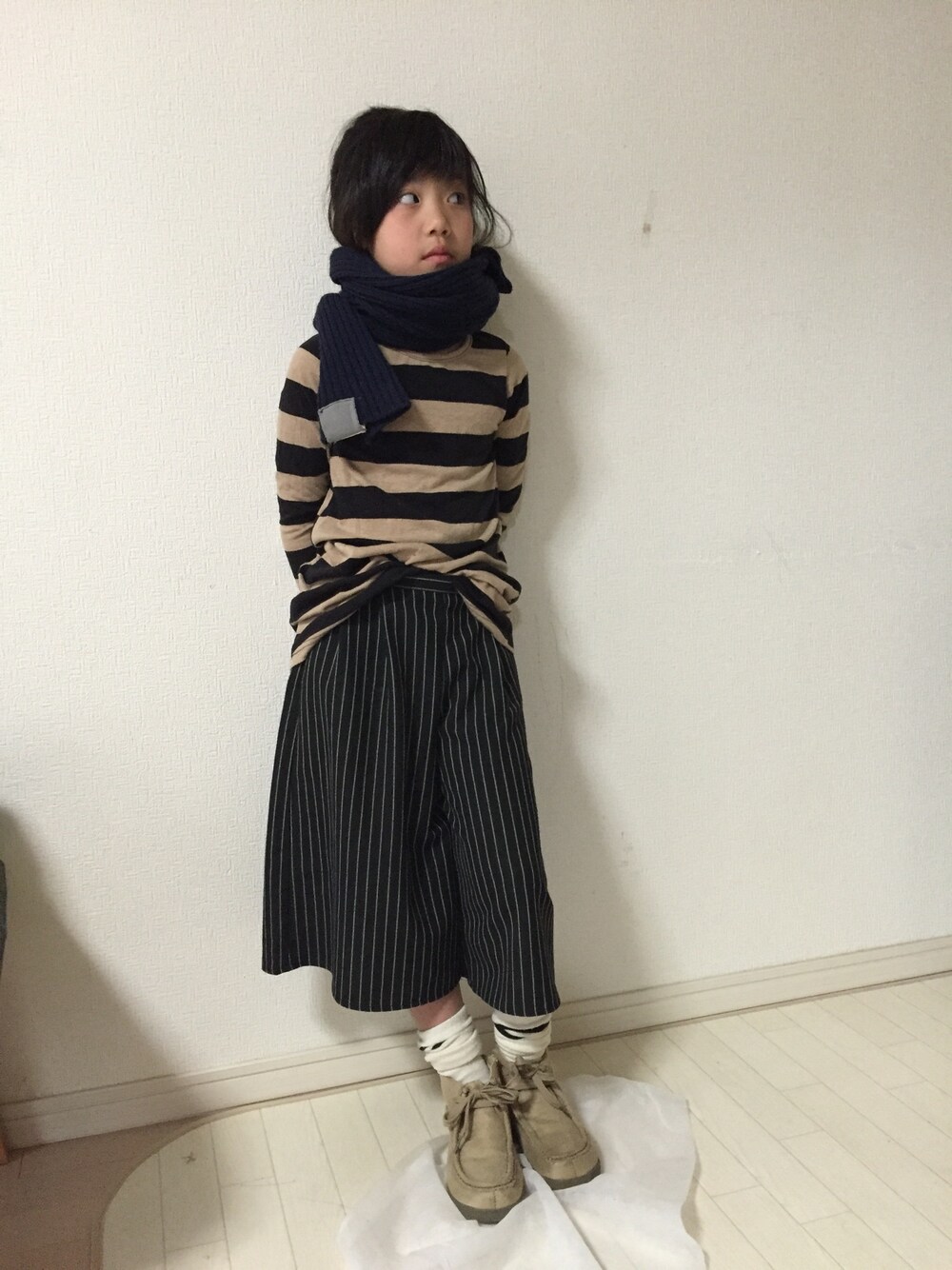 「GUのアイテム（パンツ、ブラック系）」を使った、獅子舞さん（キッズ・126cm）の春コーディネートの1枚目の写真