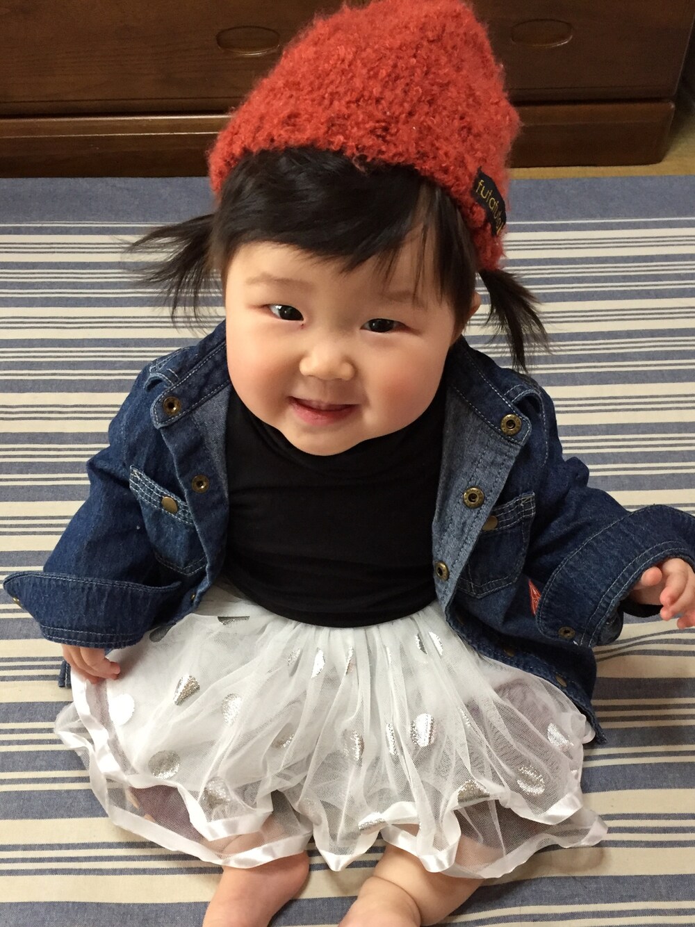 「Birthdayのアイテム（帽子、オレンジ系）」を使った、coconaさん（キッズ・80cm）の冬コーディネートの1枚目の写真