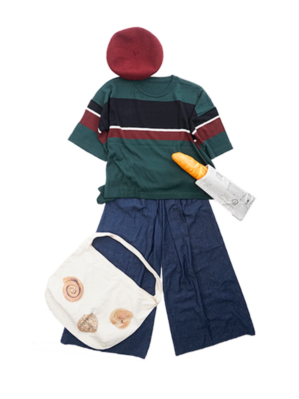 グリーン系のニット/セーター、ブルー系のデニムパンツを着用したレディースの秋コーディネートの1枚目の写真