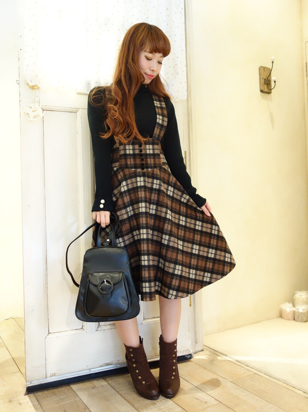 ブラック系のバックパック/リュックを着用したレディースの冬コーディネートの1枚目の写真