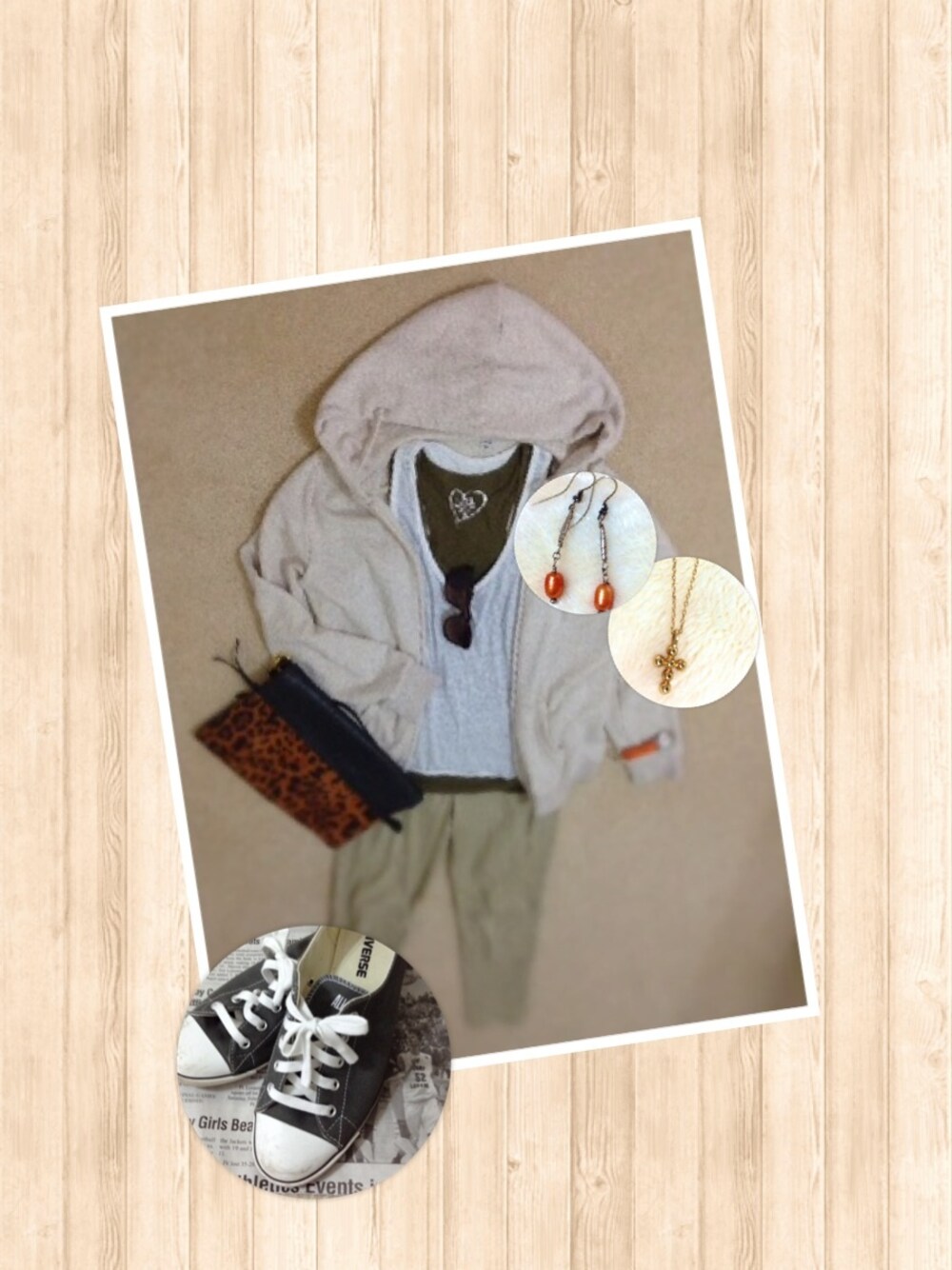 ブラウン系のクラッチバッグ、オレンジ系のピアス(両耳用)、ブラウン系のサングラスを着用したレディースの春コーディネートの1枚目の写真