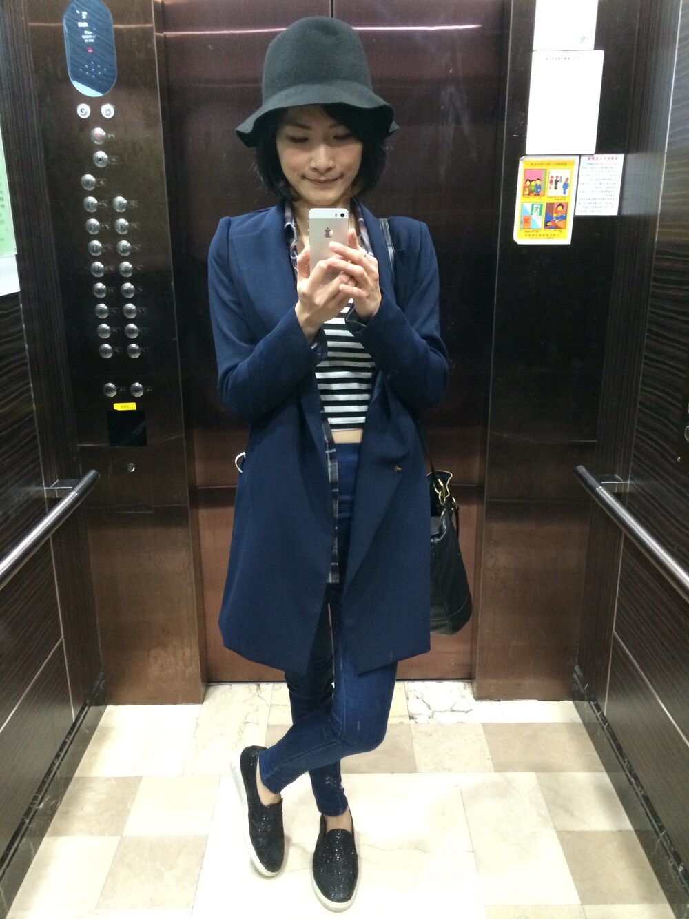 「COACHのアイテム（バックパック/リュック、ブラック系）」を使った、陳小慈さん（レディース・163cm）の秋コーディネートの1枚目の写真