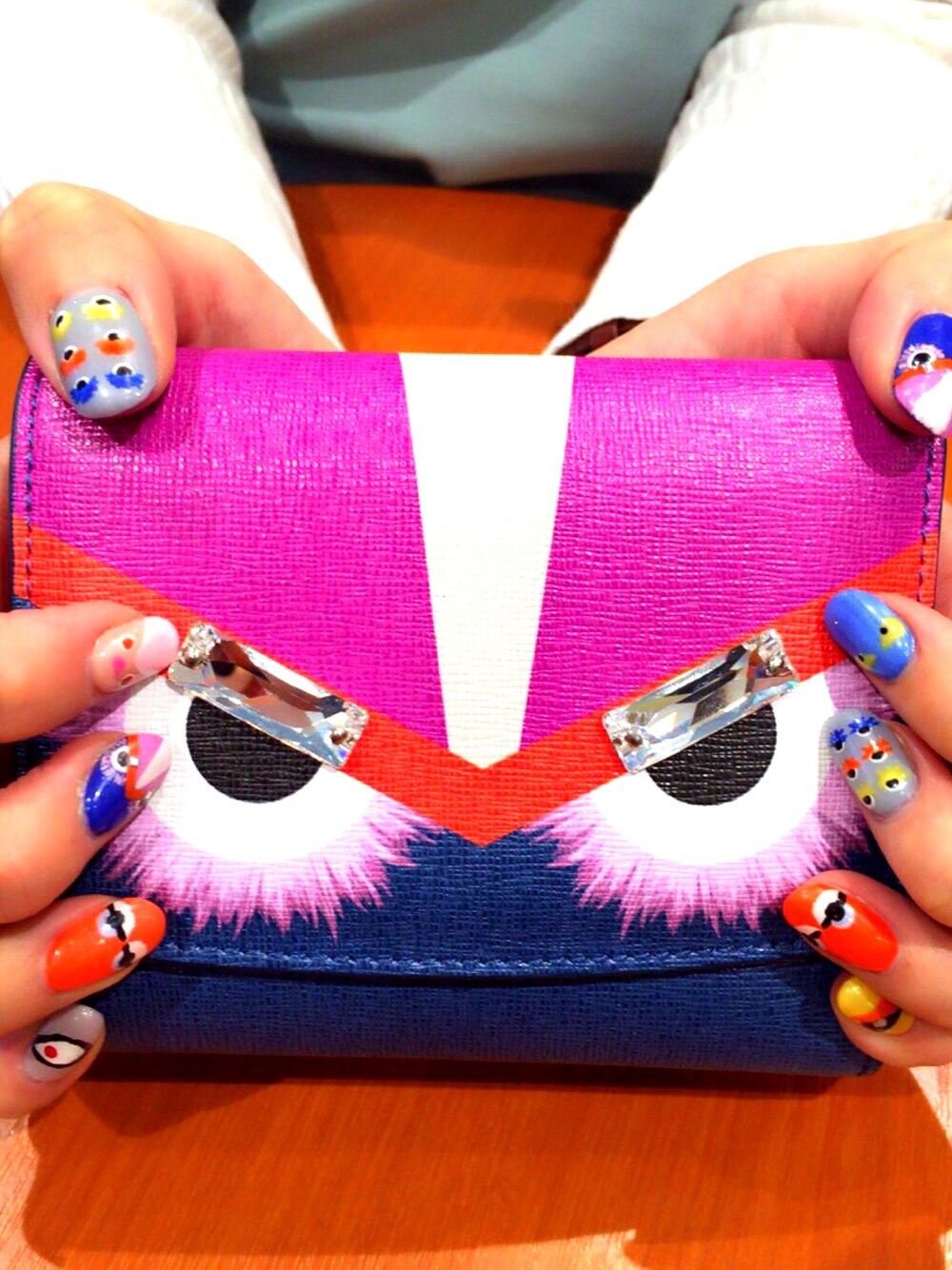 「ネイル、モンスター、FENDI、お財布、お気に入り、カラフル、顔モチーフ、どれが好き？」｜「FENDIのアイテム（財布、その他）」を使った、pinkさん（レディース・165cm）の春コーディネートの1枚目の写真