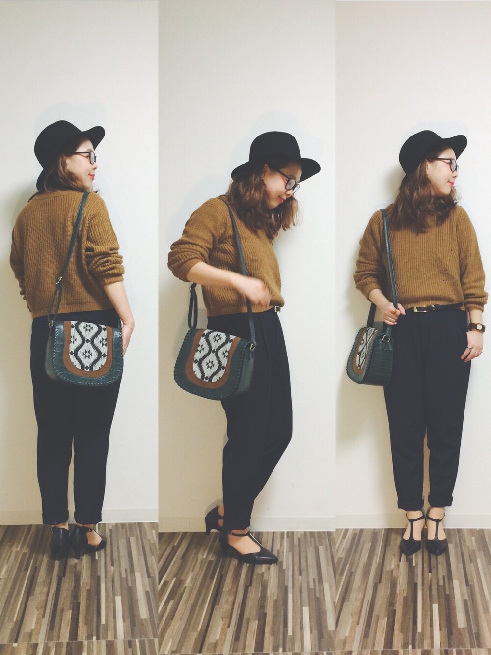 ブラック系のパンプス、グリーン系のショルダーバッグ、ブルー系のスラックスを着用したレディースの秋コーディネートの1枚目の写真