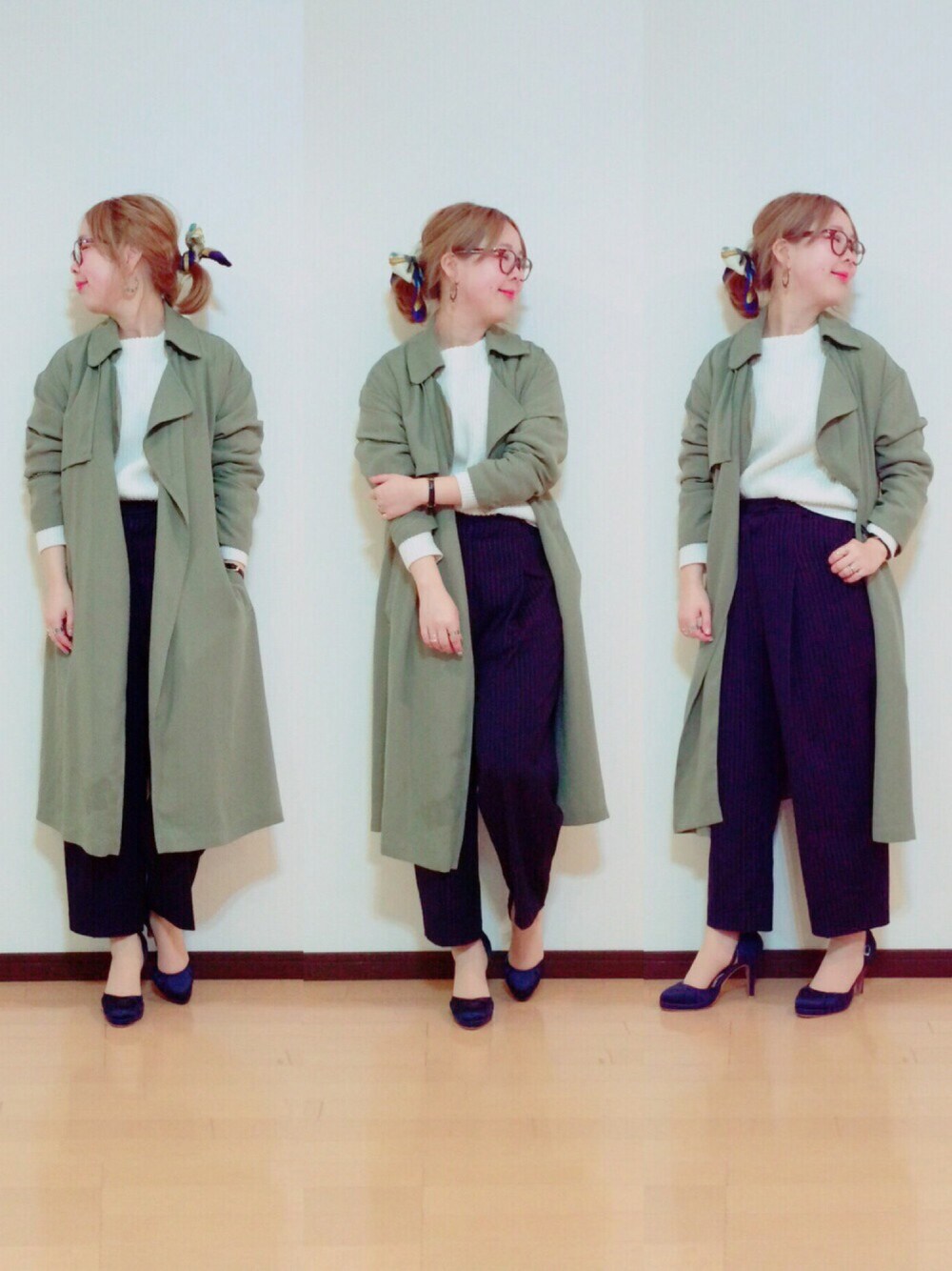 グリーン系のトレンチコート、ブルー系のその他パンツ、ホワイト系のニット/セーターを着用したレディースの冬コーディネートの1枚目の写真