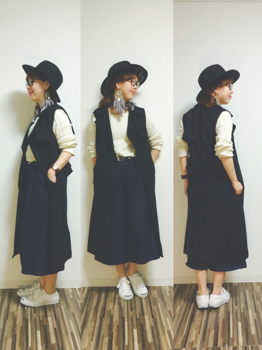 ブラック系のトレンチコート、ブラック系のハット、グレー系のピアス(両耳用)を着用したレディースの秋コーディネートの1枚目の写真